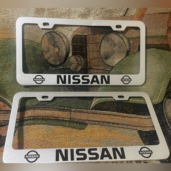 Set of 2 NISSAN License Plate Frames Brushed Steel NEW (very slight dent) - Picture 1 of 4